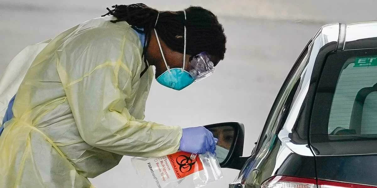Drive-through testing centers are opening around the US — photos show how the makeshift operations check people for coronavirus