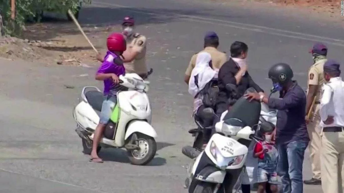 Indian police use force on lockdown violators - CNN Video
