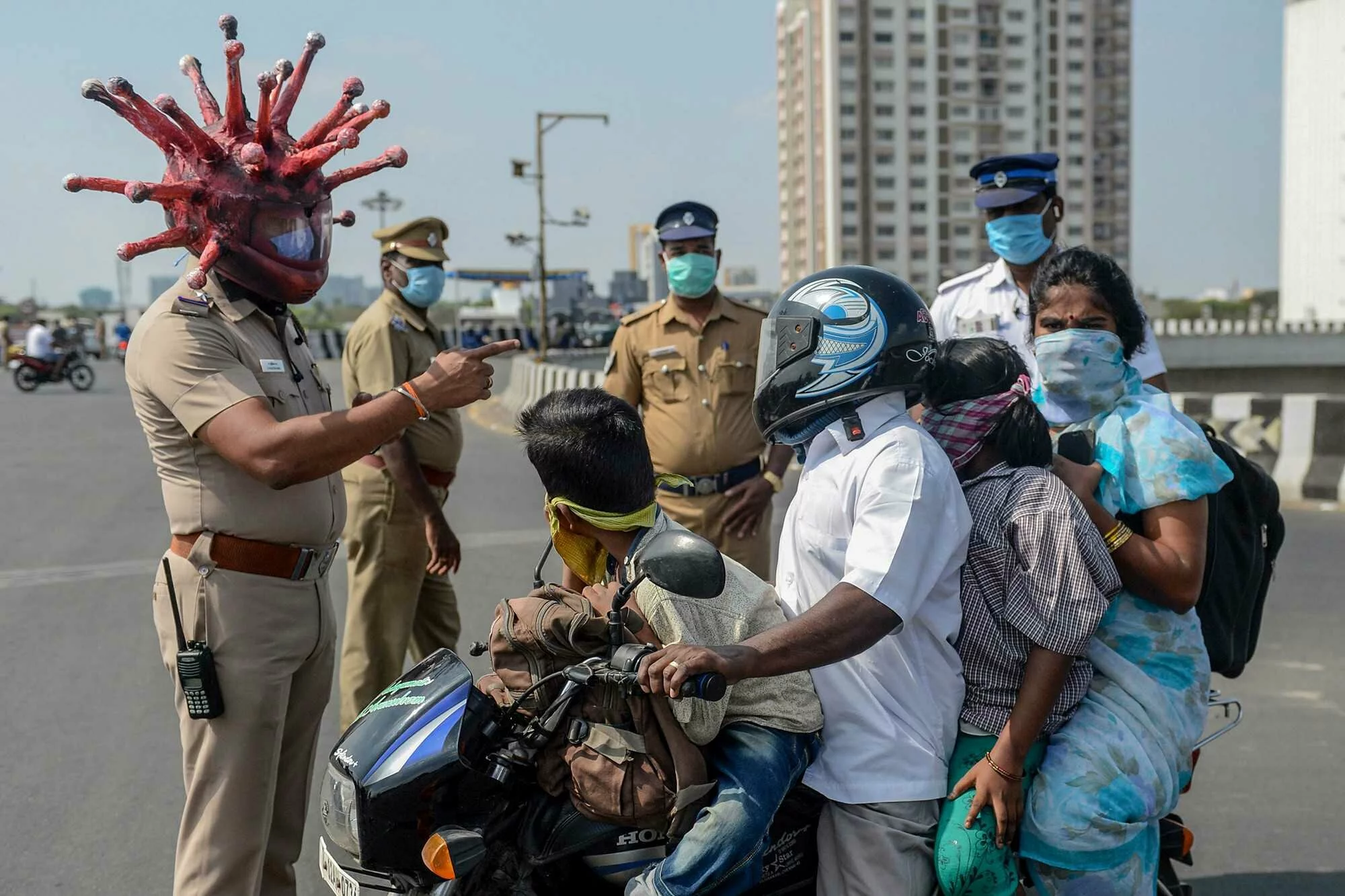 Cops wear coronavirus helmets to scare residents into lockdown in India