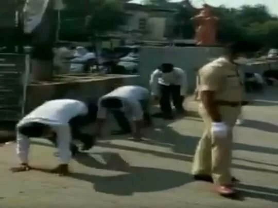 Coronavirus: Police in India make people do yoga for violating lockdown