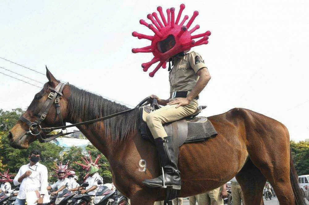 ‘Corona cops’ wearing spiky ‘virus’ helmets during India’s lockdown